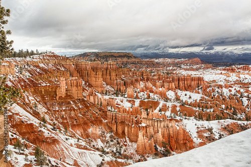 Snowy clouds over red rocks of the Bryce Canyon, Utah
