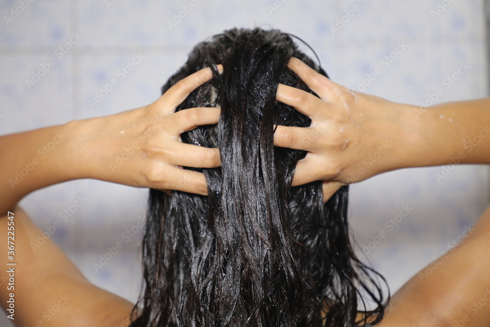 Indian Mexican Lady Bathing hair wash her hairs massaging hair and body  with hands visible soap
