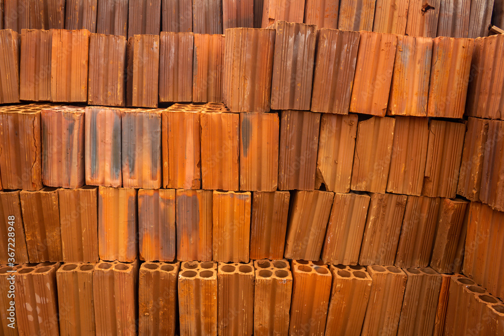8-hole orange fired ceramic brick. Material for the construction of houses. 8-hole orange fired ceramic brick. Material for the construction of houses.