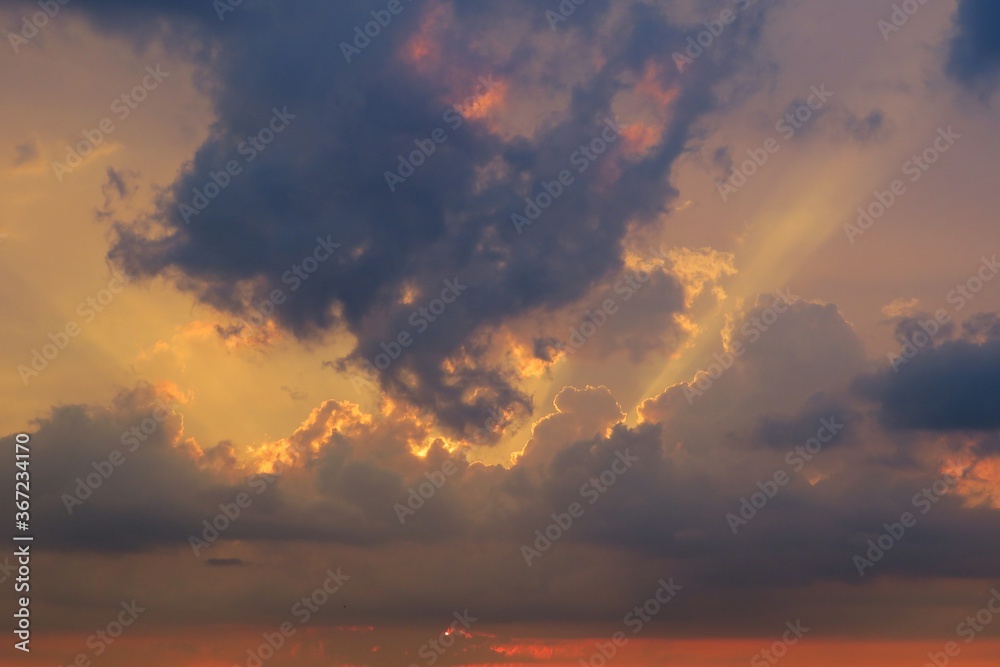 Beautiful dark dramatic clouds in the sky at sunset, natural background