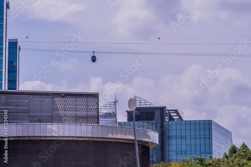 Cable car above city buildings