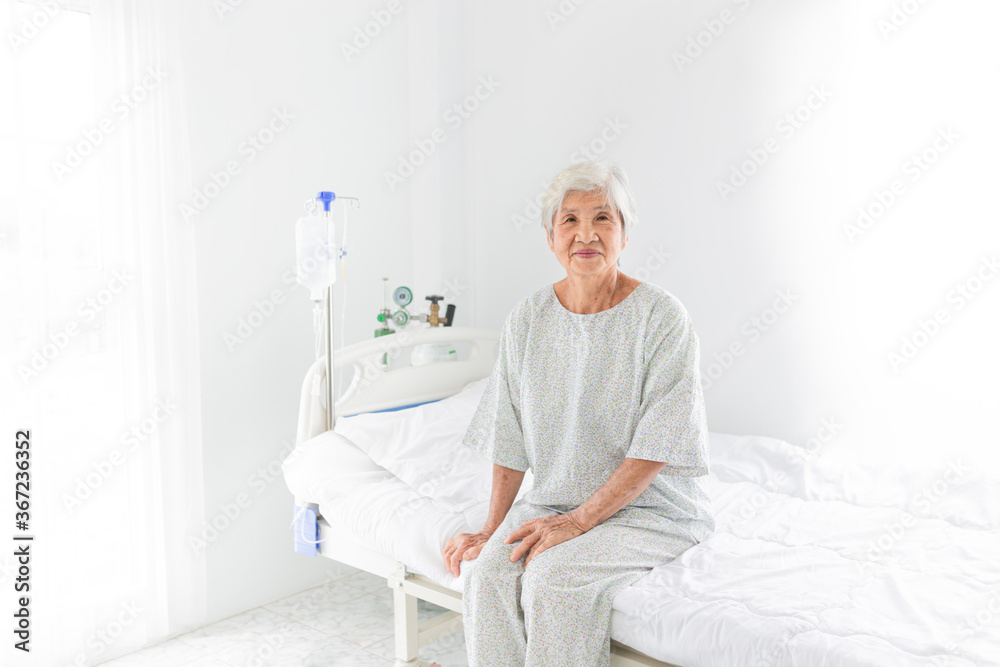 old asian patient sitting on bed, she feeling happy and smile in hospital, elderly healthcare old asian patient sitting on bed, she feeling happy and smile in hospital, elderly healthcare