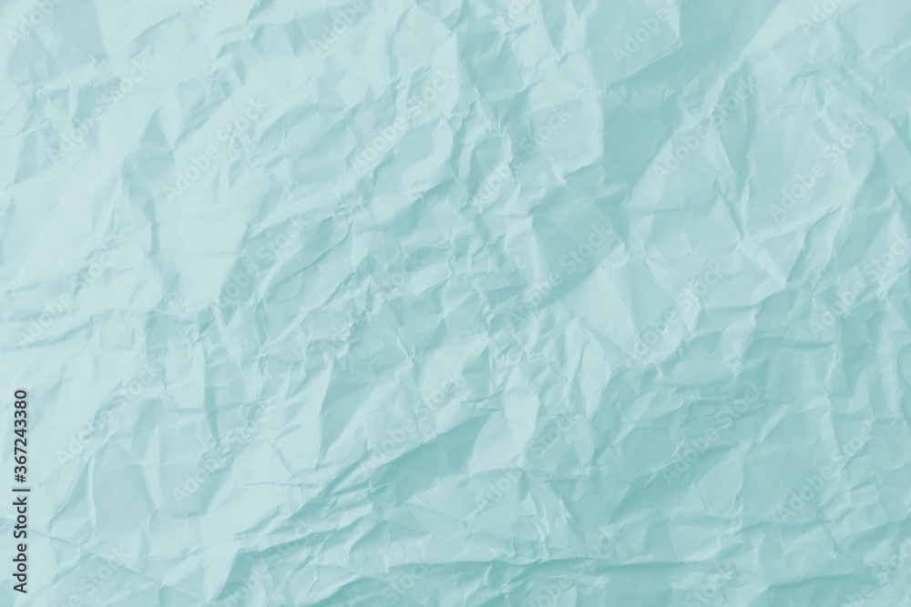 Obraz premium Top view of blue crumpled paper background.