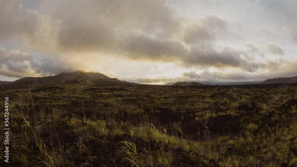 sunrise in kintamani. volcano Batur Bali Indonesiai. caldera view. unesco. Fast clouds moving. Timelapse hyperlapse 4K video. black lava. vulcano Abang Agung sunrise in kintamani. volcano Batur Bali Indonesiai. caldera view. unesco. Fast clouds moving. Timelapse hyperlapse 4K video. black lava. vulcano Abang Agung