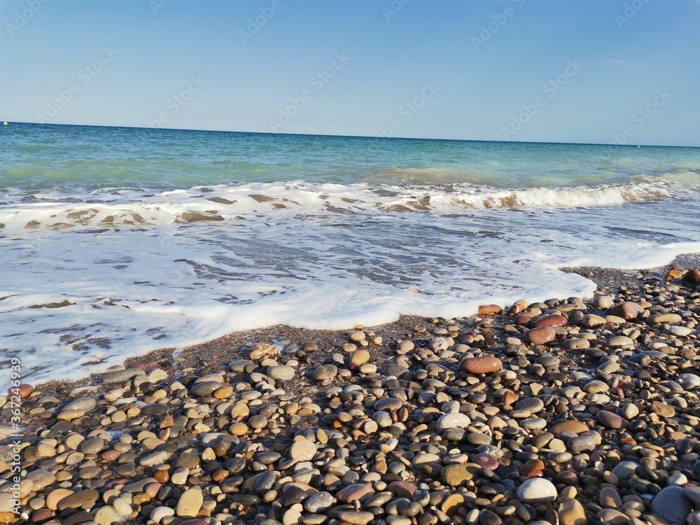 Stone beach and turquoise sea Stone beach and turquoise sea