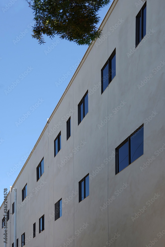 Low angle view of the uniform facade of an uninspiring general business building
