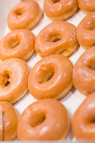 Bakery fresh soft and sweet delicious glazed donuts in box