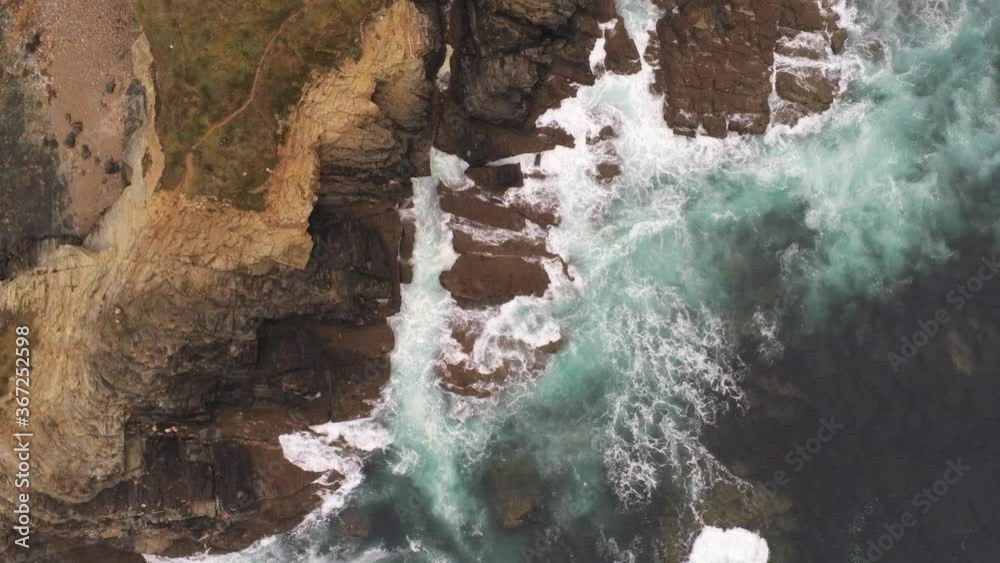 Beautiful Coastline view and waves crashing on rocky cliff shoreline. Aerial Drone Video Beautiful Coastline view and waves crashing on rocky cliff shoreline. Aerial Drone Video