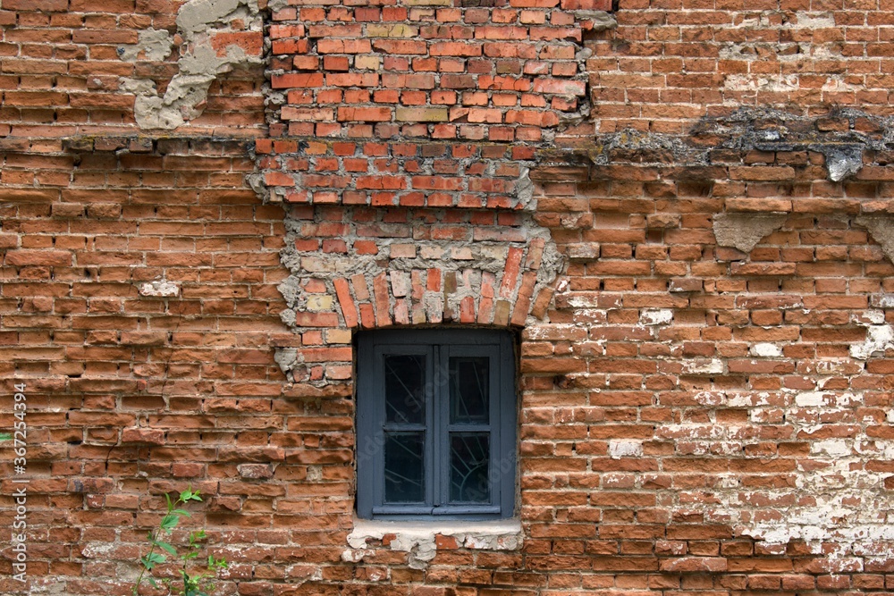 small window in old brick wall