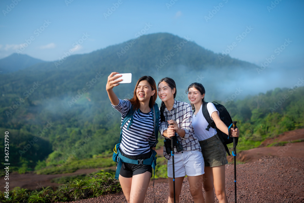 Group of asian woman hiker taking photo