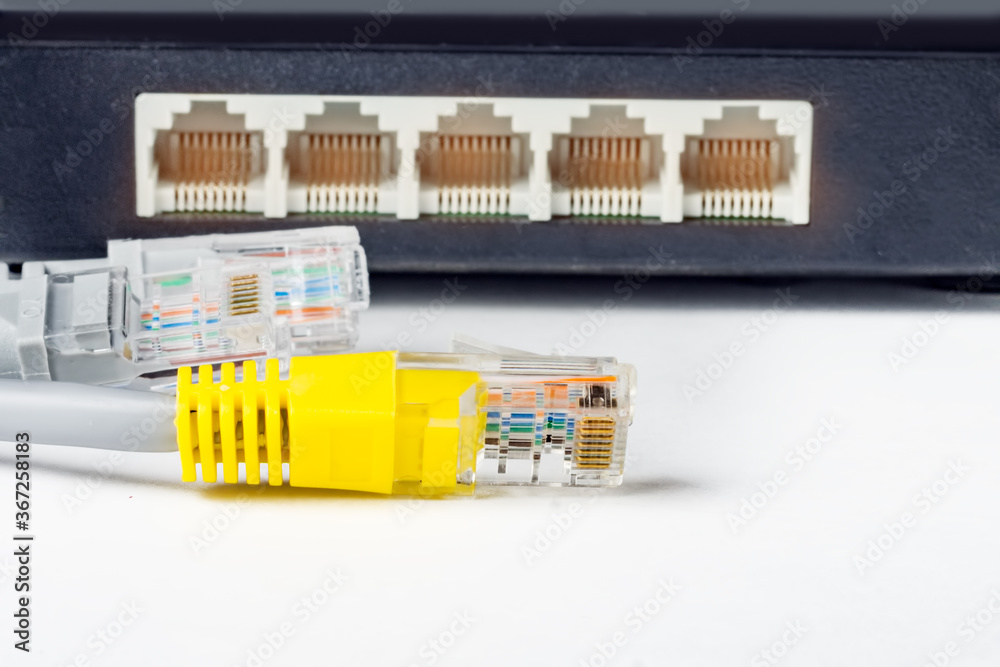 Network switch and optical fiber cables on white background Network switch and optical fiber cables on white background