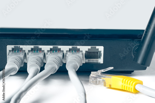 Network switch and optical fiber cables on white background