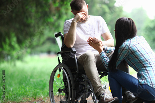Obraz na plátně Woman calm down man in wheelchair