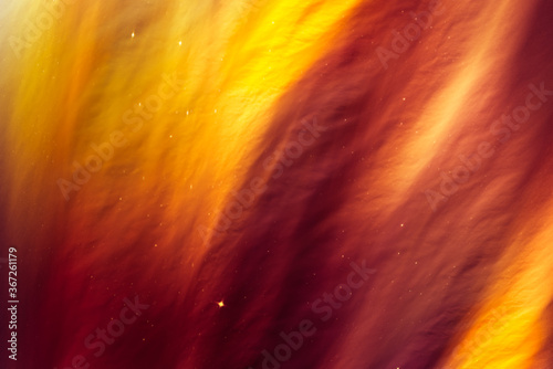 Mysterious abstract background in a warm autumn palette. Bright and colorful, it attracts attention with a combination of red and gold.