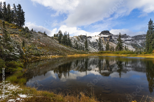 Fototapeta Naklejka Na Ścianę i Meble -  Scenic view on beautiful mountain reflection on tiny lake water. Location place is the North Cascades National park, Washington, USA