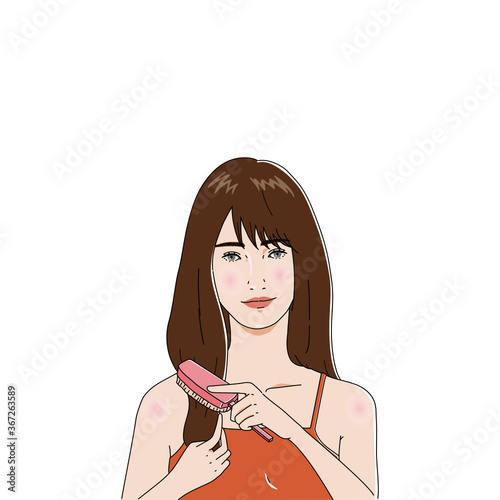 ヘアケア　ヘアブラシでかみをとかす女性
