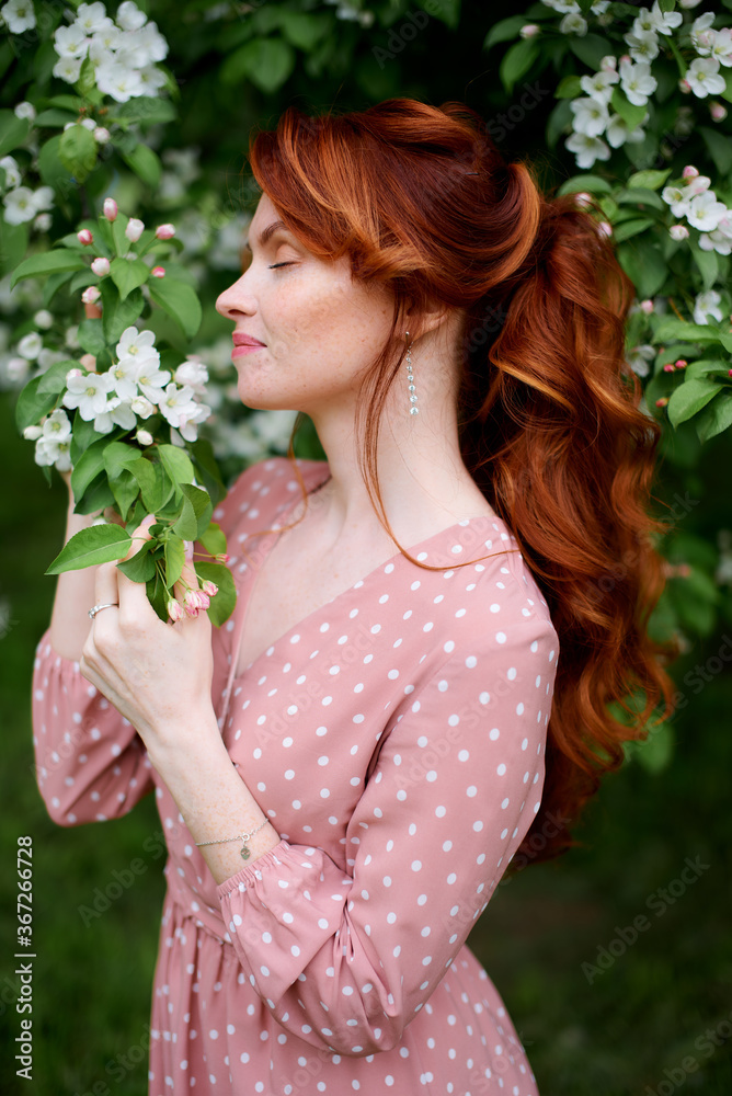 Russian redheaded pretty girl in apple trees Russian redheaded pretty girl in apple trees