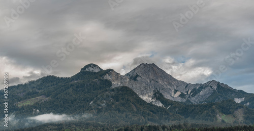 Gray Mittagskogel hill in summer cloudy dark day