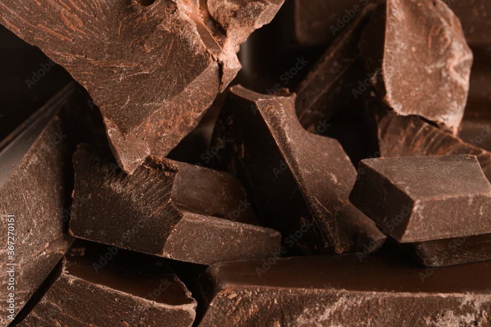 Pieces of dark chocolate as background, closeup Pieces of dark chocolate as background, closeup