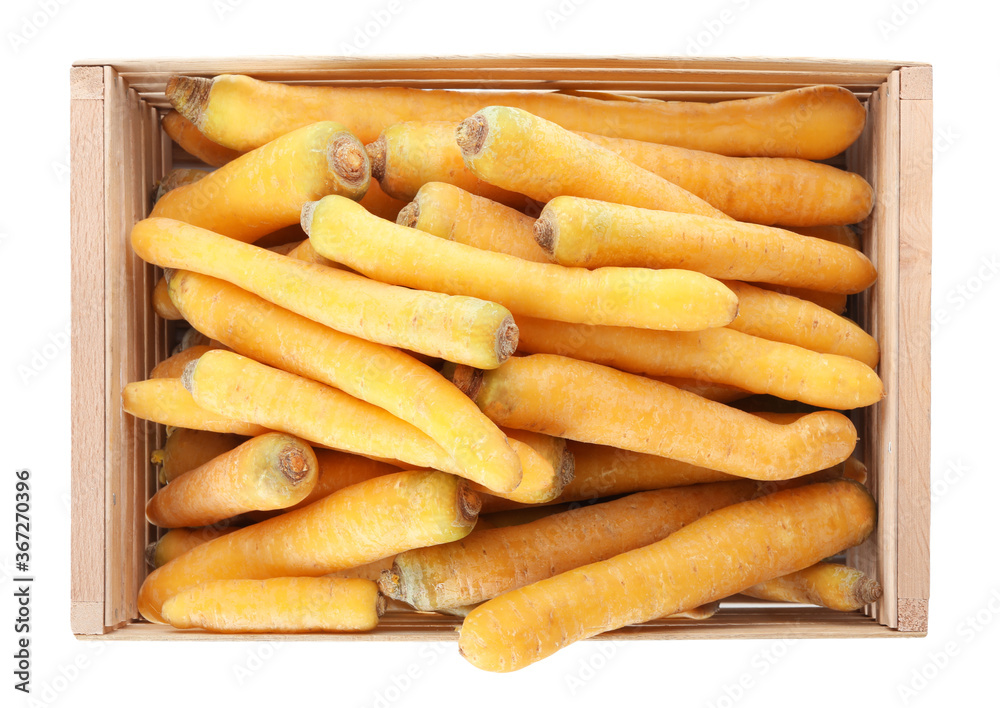 Raw yellow carrots in wooden crate isolated on white, top view Raw yellow carrots in wooden crate isolated on white, top view