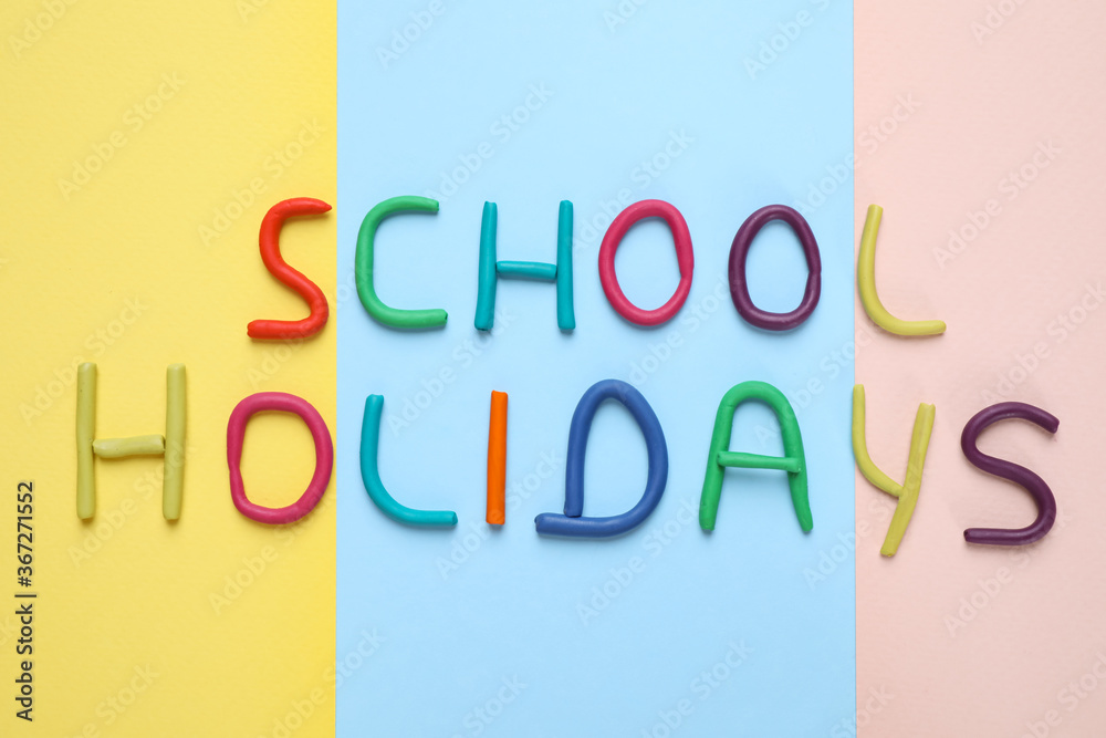 Phrase School Holidays made of modeling clay on color background, top view Phrase School Holidays made of modeling clay on color background, top view
