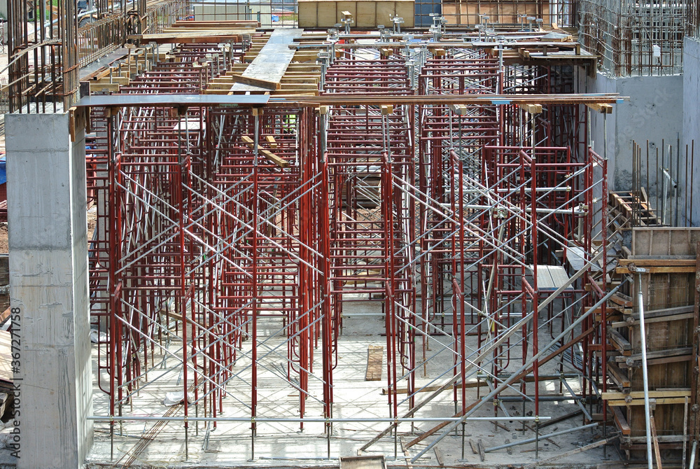 Obraz premium JOHOR, MALAYSIA -APRIL 13, 2016: Scaffolding used as the temporary structure to support platform, form work and structure at the construction site. Also used it as a walking platform for workers. 