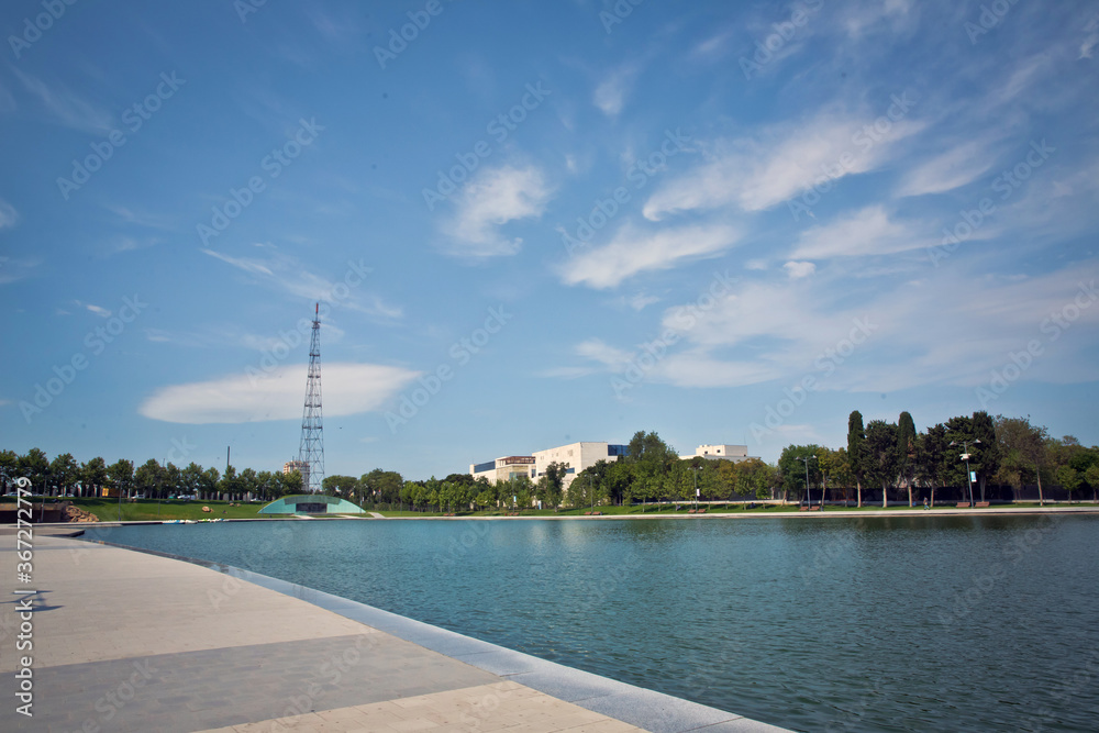 Baku zoological park . Bak Zooloji Park . artificial lake in the park Dede Korkud . Light clouds with blue sky . Dada Korkut Park .