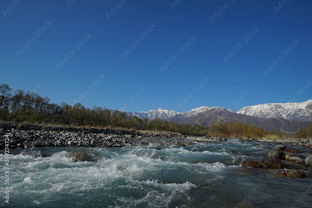 typical mountain landscape of Japanese alps in Hakuba at early Autumn typical mountain landscape of Japanese alps in Hakuba at early Autumn
