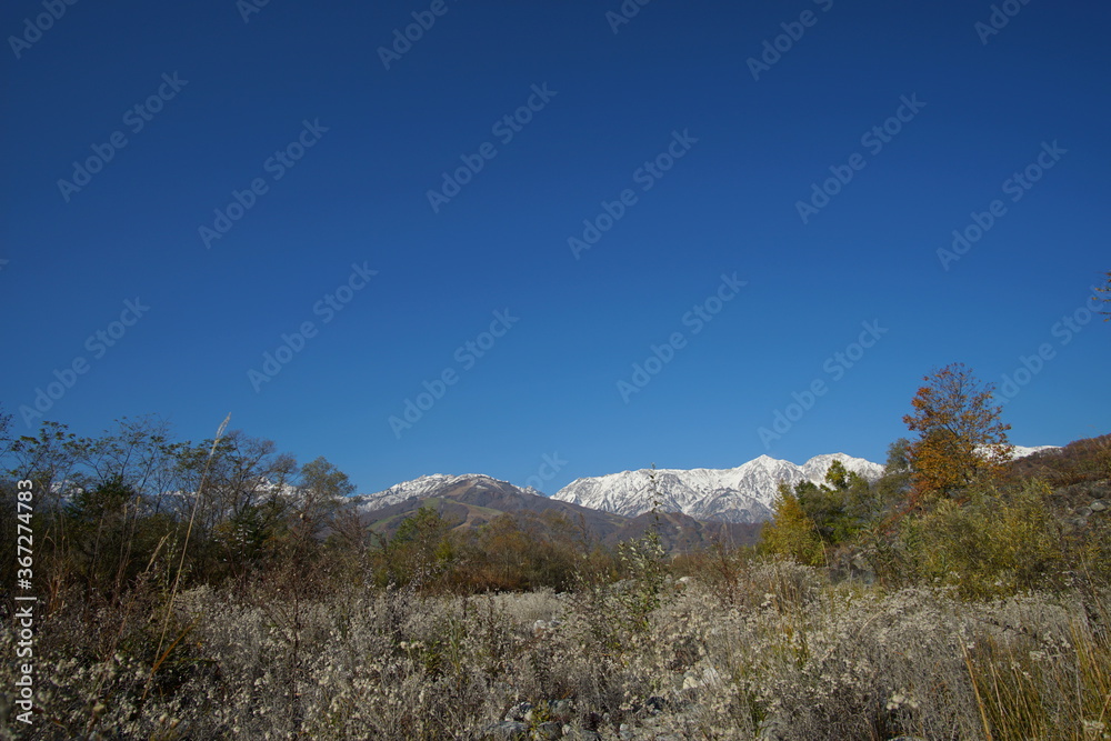 typical mountain landscape of Japanese alps in Hakuba at early Autumn typical mountain landscape of Japanese alps in Hakuba at early Autumn