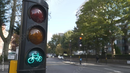 A traffic light for cyclists switching from red to green. photo