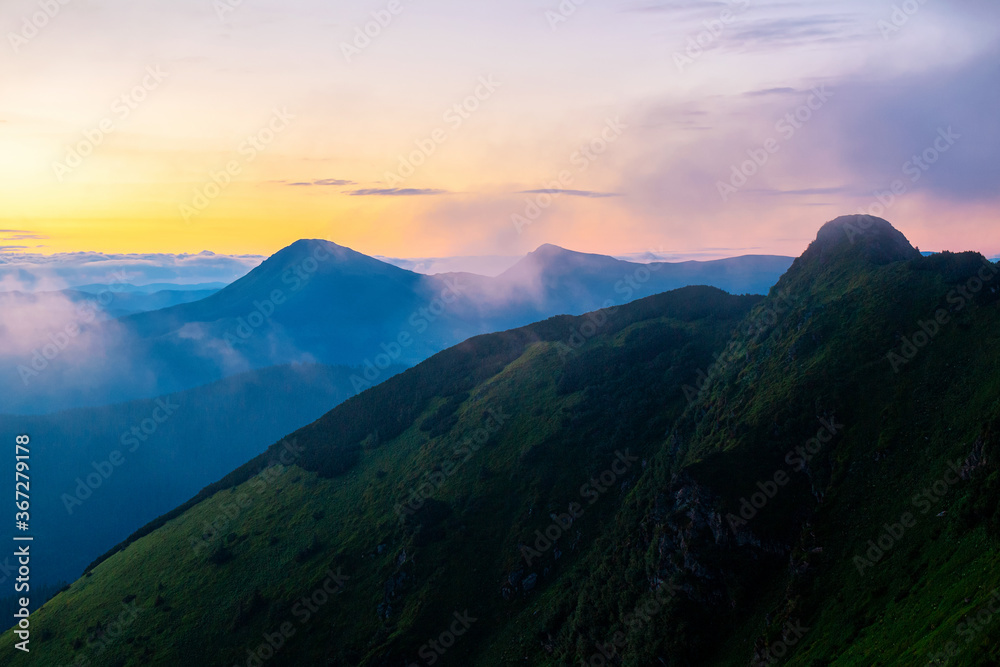Colorful sunrise landscape in the mountains, scenic wild nature panorama at the dawn, Carpathians