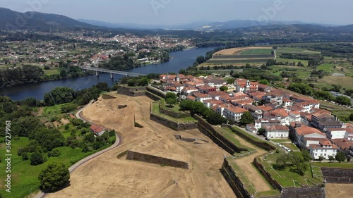 DRONE  AERIAL FOOTAGE: Fortress of Valenca do Minho in Portugal. Valença is a walled town located on the left bank of Minho River. The fortress is a piece of gothic and baroque military architecture. photo