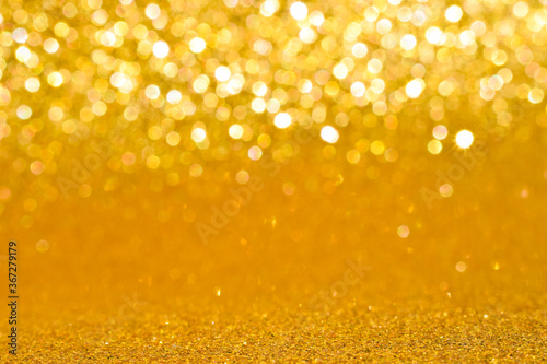 sparkles of golden glitter texture background 