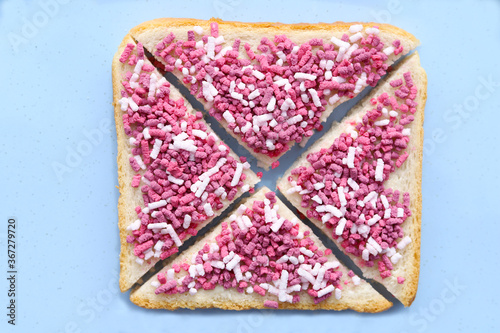 Open sweet sandwich with colored sprinkles called bosvruchtenhagel. Dutch food concept.