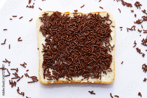 Open sweet sandwich with chocolate sprinkles.  Typical Dutch food.