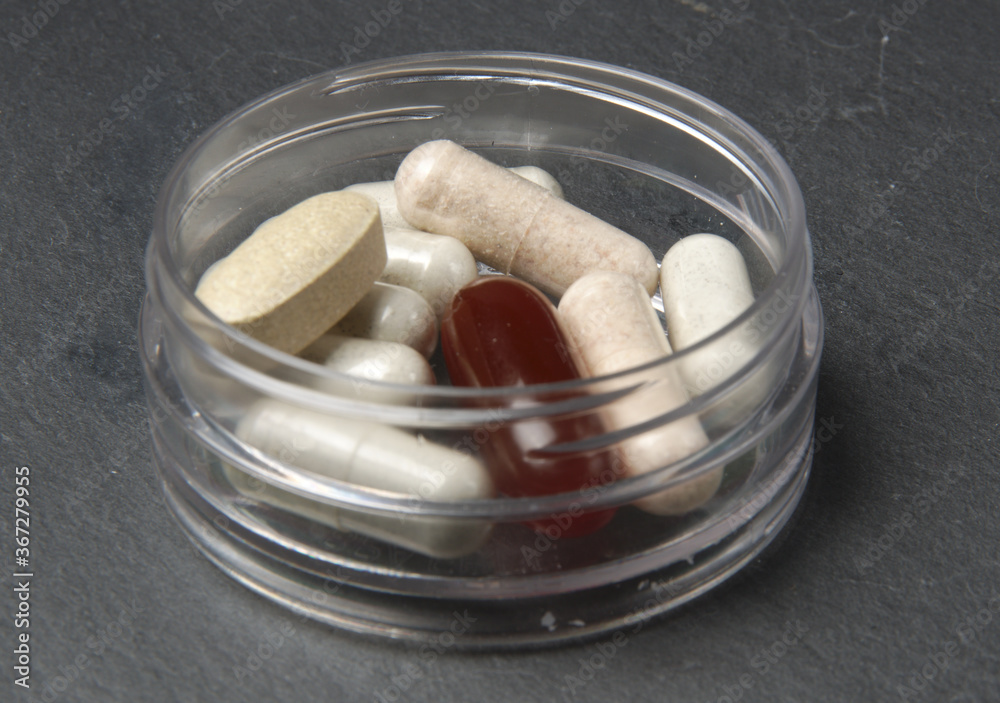 pills in glass pills in glass