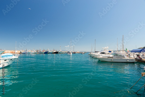 Porto Santo Stefano harbor with boats and the sea © Federico