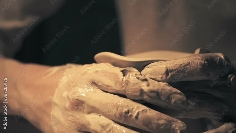 Woman's hands create Ceramic Pot