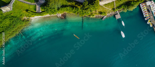 Ledro lake in Trentino Alto Adige, Italy. Top view of the lake with the prehistoric canoe. Prehistoric canoe reconstruction