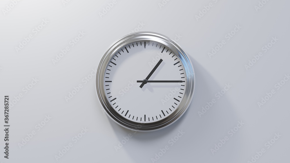Glossy chrome clock on a white wall at quarter past one. Time is 01:15 or 13:15 Glossy chrome clock on a white wall at quarter past one. Time is 01:15 or 13:15
