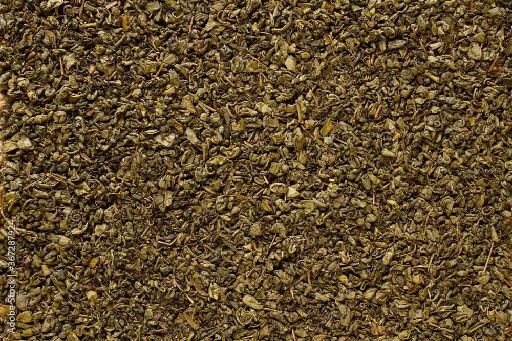 Texture with loose leaf green tea, top view. Texture abstract background.  Horizontal background.  concept for design or For add text . Background. Close Up.