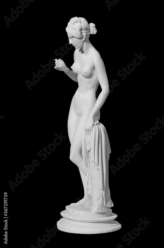 statue of a naked woman on a black background