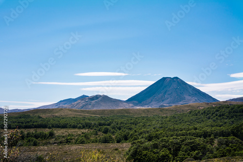 Volcanic cone of Mount Ngauruhoe rising over flat plateau