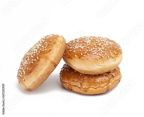 baked round bun with sesame seeds isolated on white background