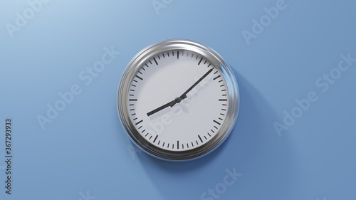 Glossy chrome clock on a blue wall at eight past eight. Time is 08:08 or 20:08