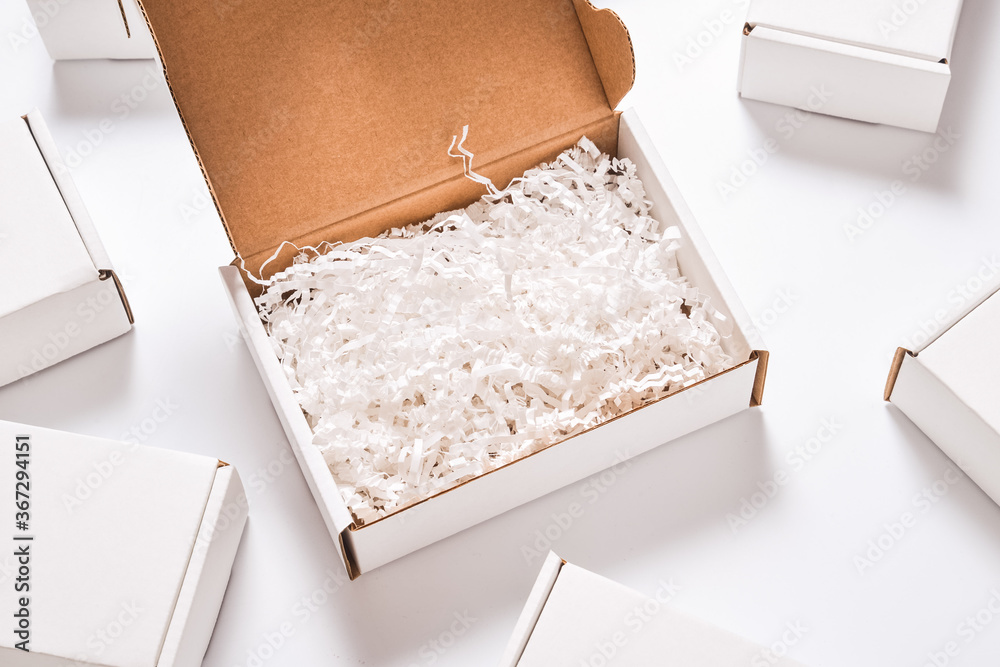 White paper filler in cardboard box, set of white carton boxes Photos |  Adobe Stock
