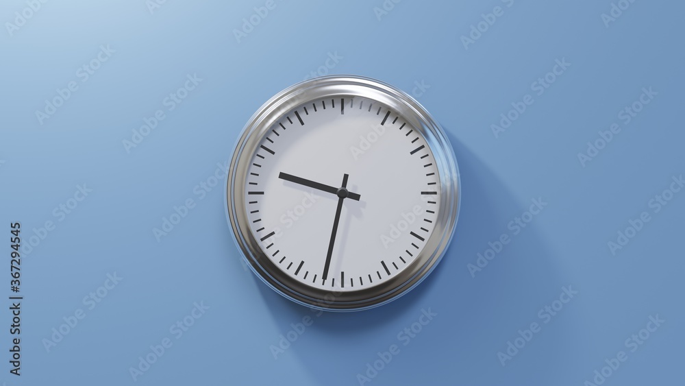 Glossy chrome clock on a blue wall at thirty-two past nine. Time is 09:32 or 21:32 Glossy chrome clock on a blue wall at thirty-two past nine. Time is 09:32 or 21:32