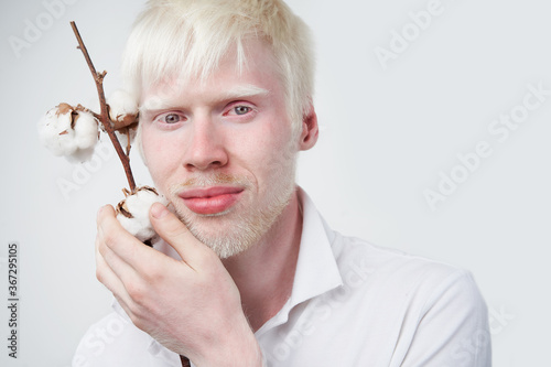 Obraz na plátne albinism albino man in studio dressed t-shirt isolated on a white background