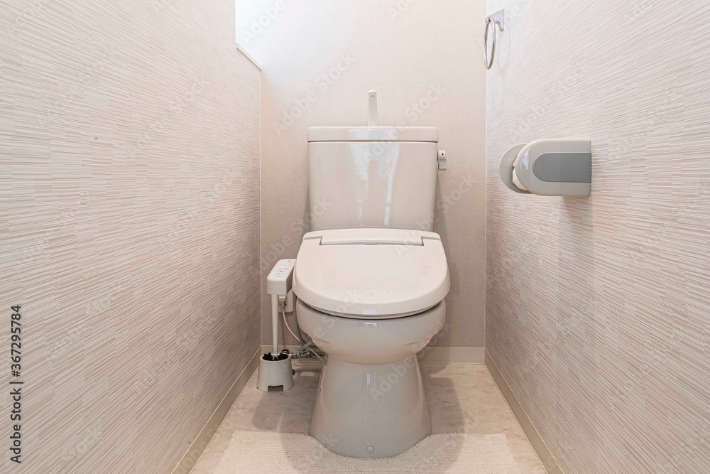 Modern automatic toilet In a small toilet in a wooden house Modern automatic toilet In a small toilet in a wooden house