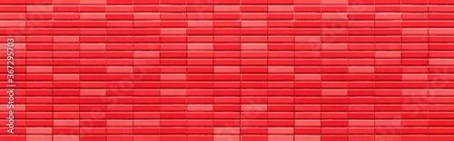 Panorama of Modern red stone wall with stripes texture and seamless background